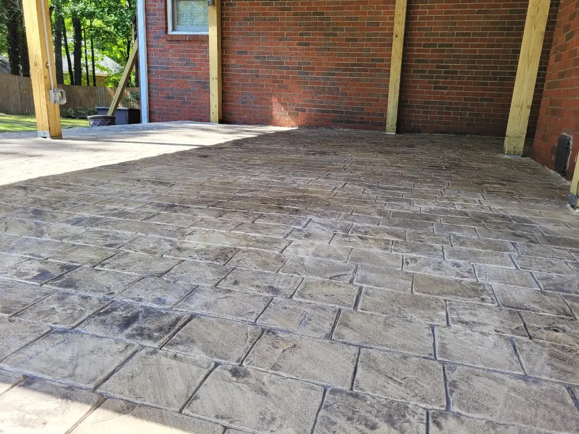 Ashlar-pattern stamped concrete patio installed by OTM Concrete