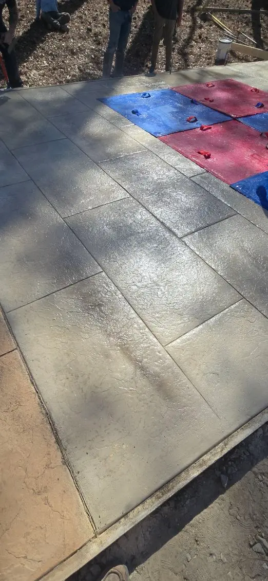 Outdoor stamped concrete patio installation by OTM Concrete