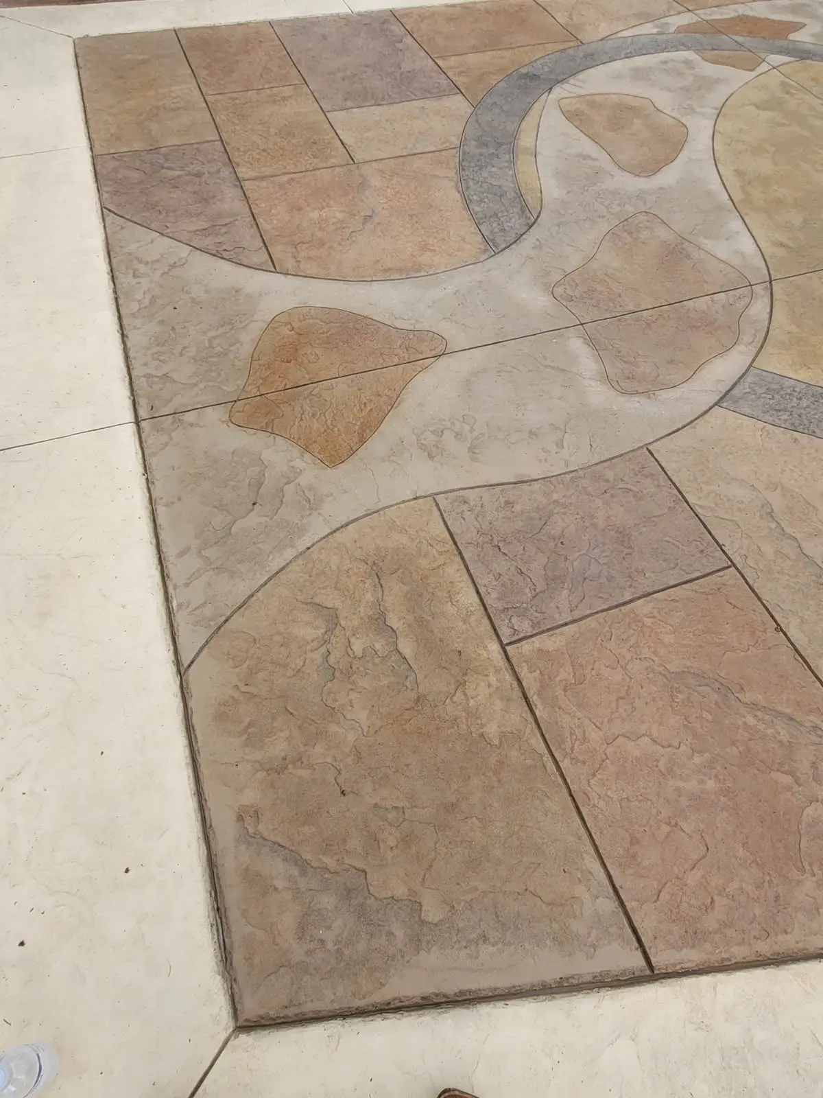 Stamped and colored decorative concrete overlay with custom stone pattern by OTM Concrete