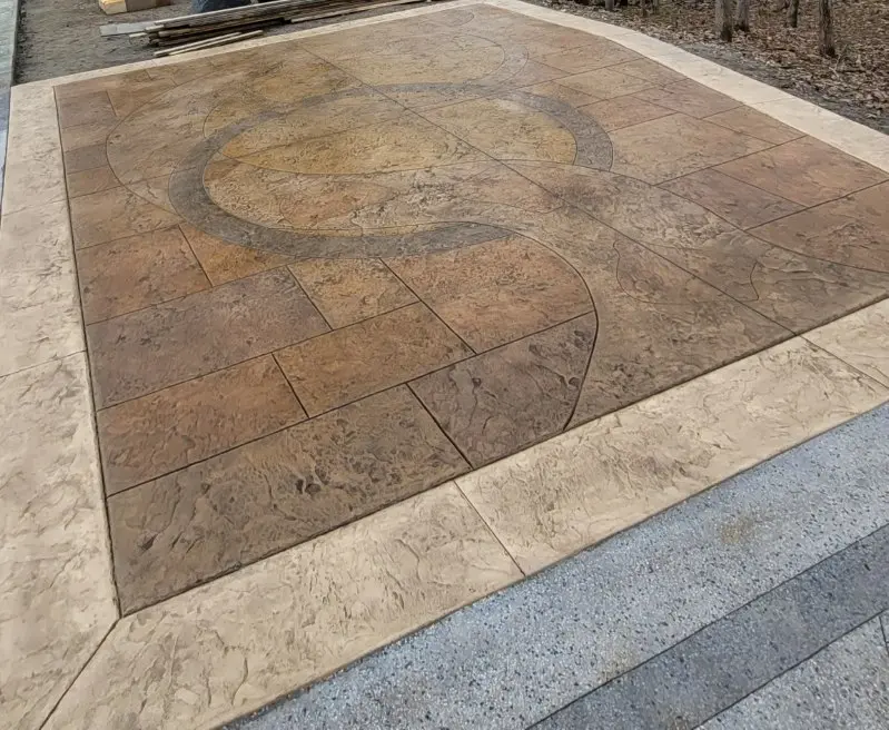 Stamped concrete patio design with custom pattern layout by OTM Concrete
