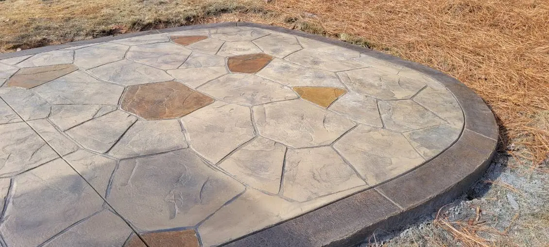 Stamped concrete patio installation in progress by OTM Concrete