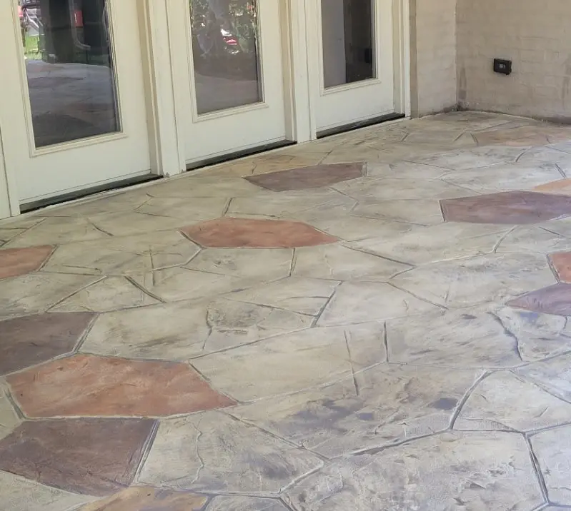 Decorative stamped concrete patio overlay installed by OTM Concrete