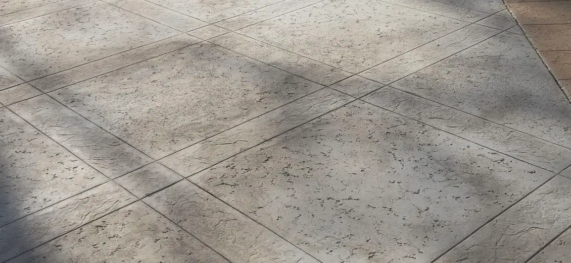 Stamped grey concrete outdoor pavement by OTM Concrete