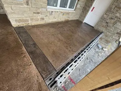 Stamped poured concrete outdoor living area by OTM Concrete